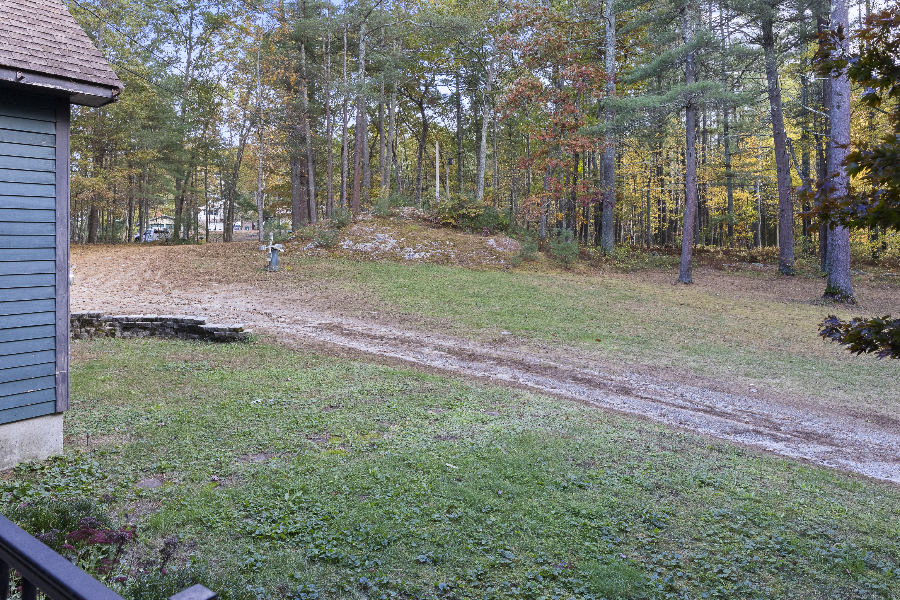 160 Munyan Road Putnam, CT 06260 - Photo 32 of 36 a backyard of a house with lots of green space