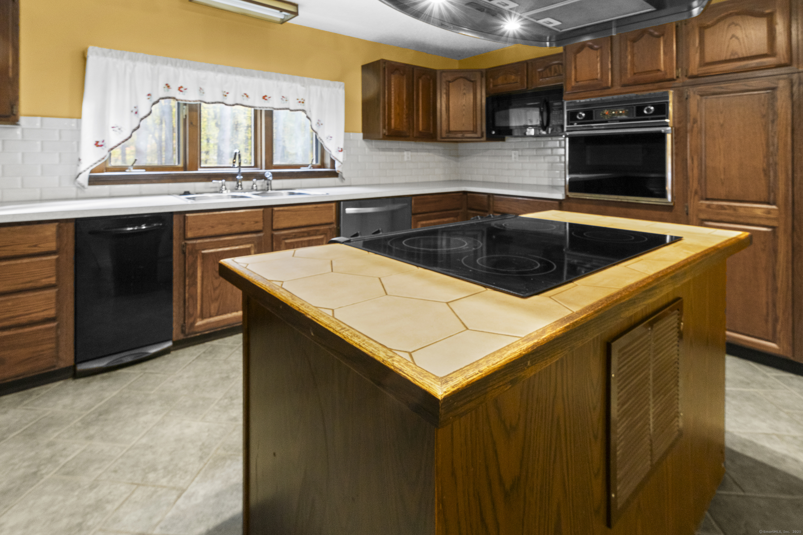 160 Munyan Road Putnam, CT 06260 - Photo 4 of 36 a kitchen with stainless steel appliances a stove a sink and a microwave
