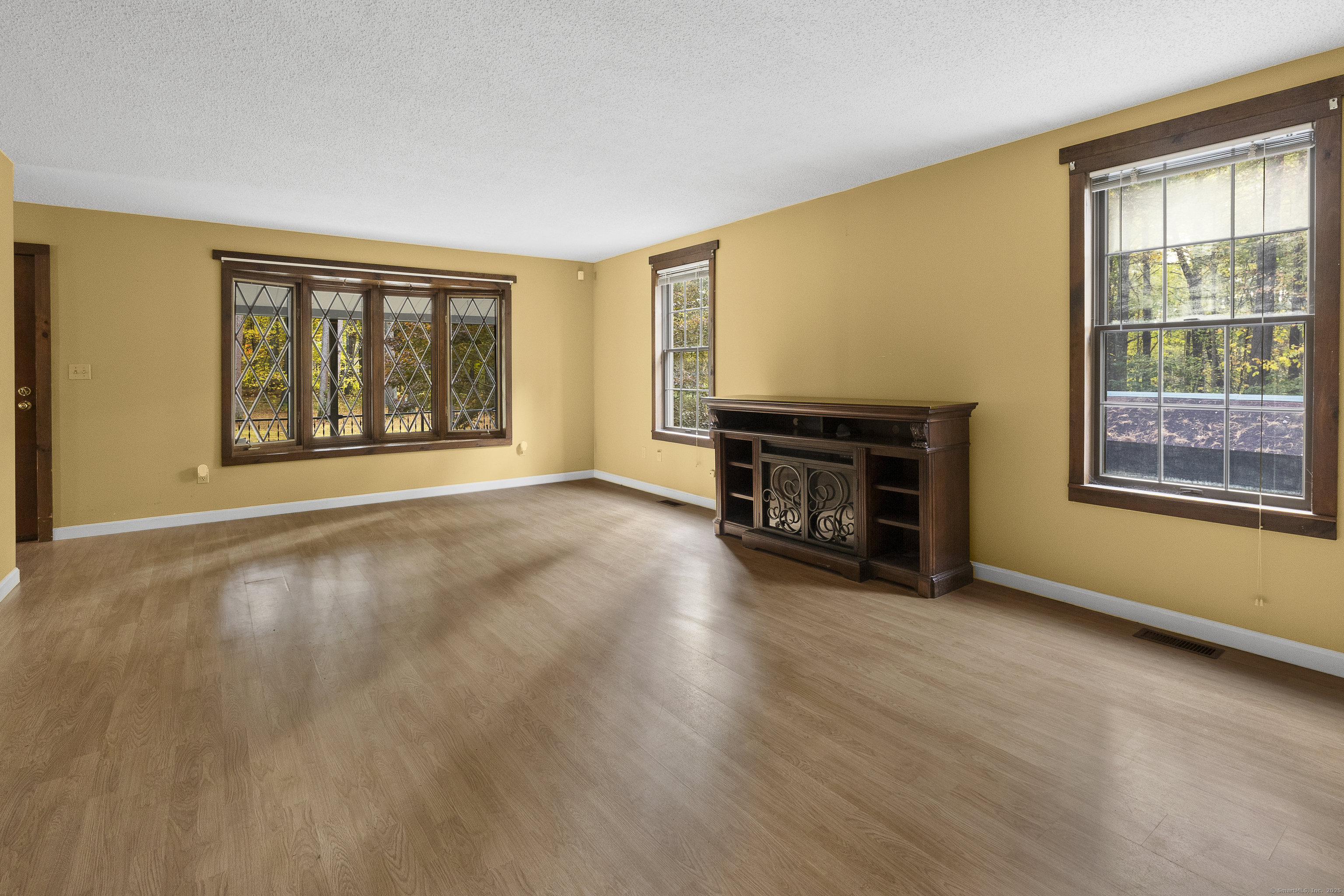 160 Munyan Road Putnam, CT 06260 - Photo 9 of 36 a view of an empty room with window and fireplace
