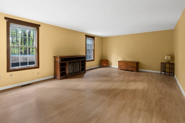 a view of workspace with furniture and window