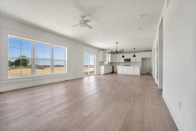 a view of a kitchen with furniture and windows