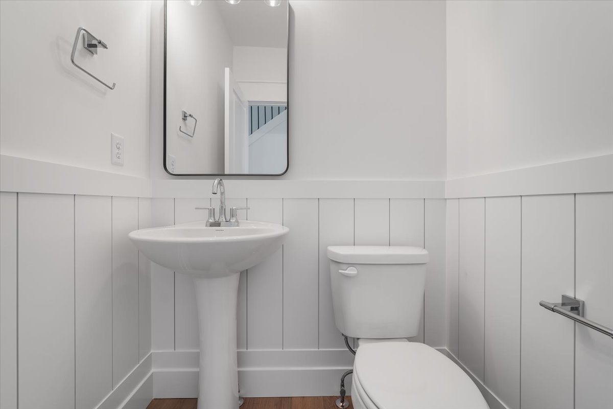 24 Stonehouse Court Bloomington, IL 61705 - Photo 20 of 45 a bathroom with a toilet a sink and mirror