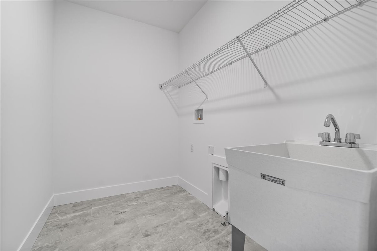 24 Stonehouse Court Bloomington, IL 61705 - Photo 23 of 45 a view of a sink and dishwasher with cabinets