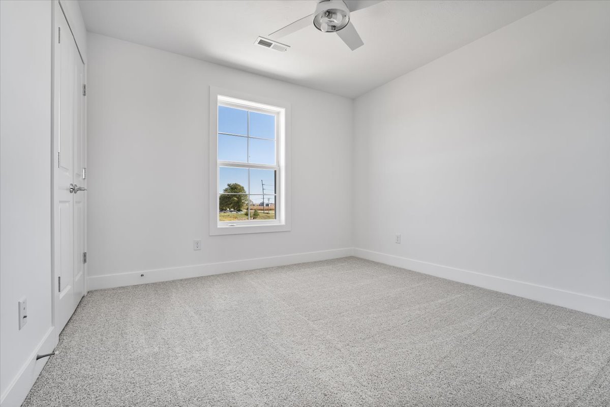 24 Stonehouse Court Bloomington, IL 61705 - Photo 29 of 45 an empty room with a window
