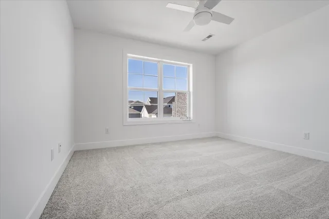 an empty room with a empty space and a window