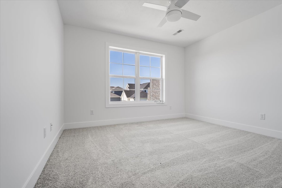 24 Stonehouse Court Bloomington, IL 61705 - Photo 32 of 45 an empty room with a empty space and a window