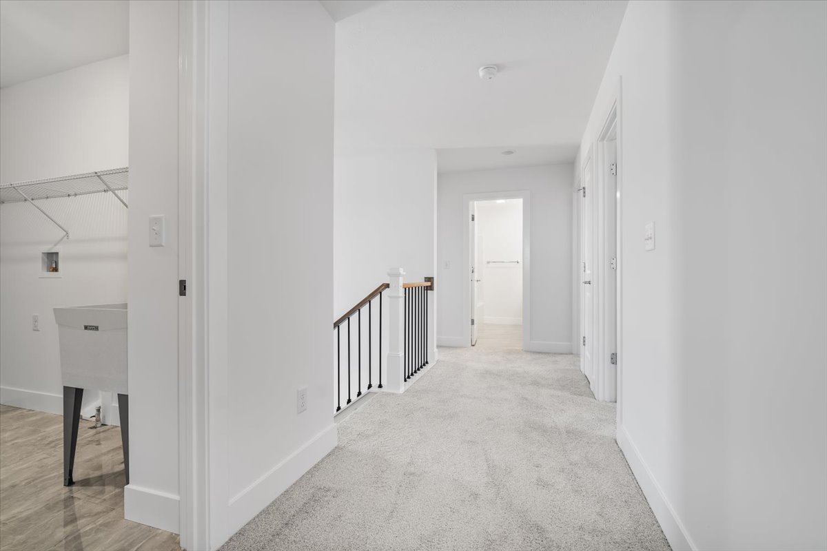 24 Stonehouse Court Bloomington, IL 61705 - Photo 34 of 45 a view of a hallway with closet and door
