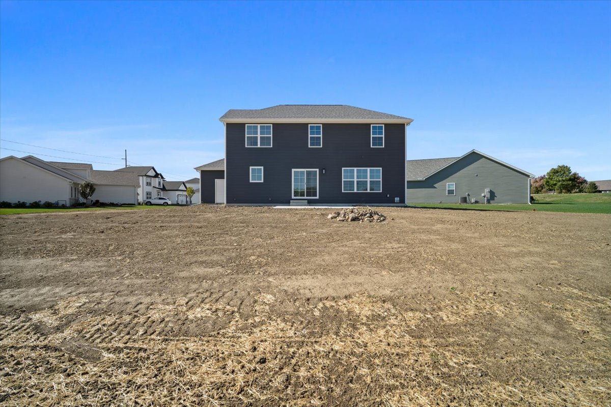 24 Stonehouse Court Bloomington, IL 61705 - Photo 44 of 45 a view of a house with a yard