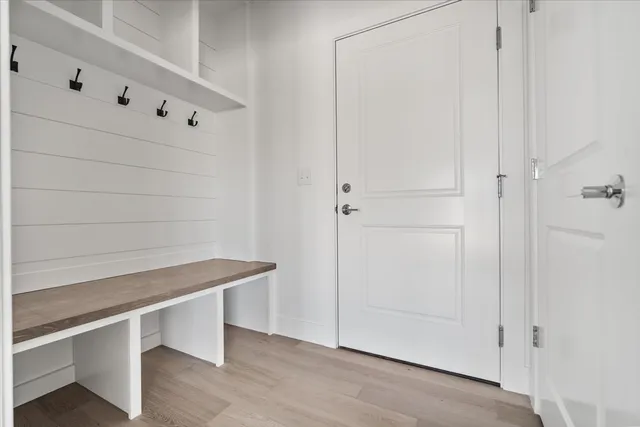 a room with table and potted plants