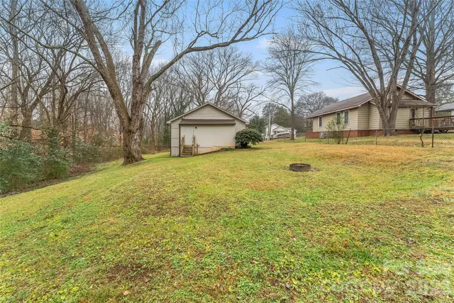 a view of large yard with a house