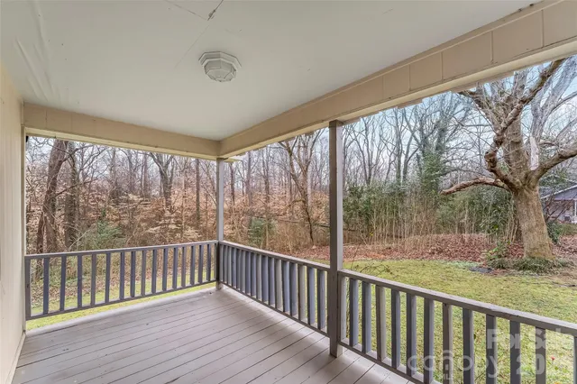 a view of balcony with yard