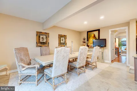 a view of a livingroom with furniture and a dining table