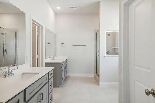 a view of a bathroom with a glass shower door