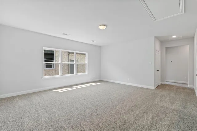 a bathroom with a granite countertop sink a mirror a toilet and a bathtub