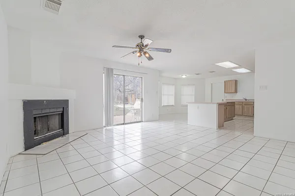 a view of a livingroom with furniture and a fireplace