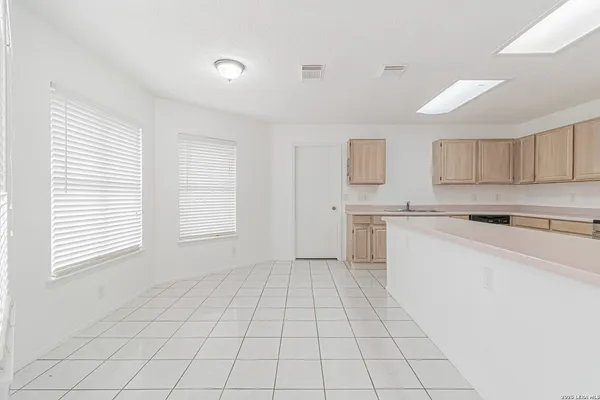 a kitchen with a stove a sink and a refrigerator