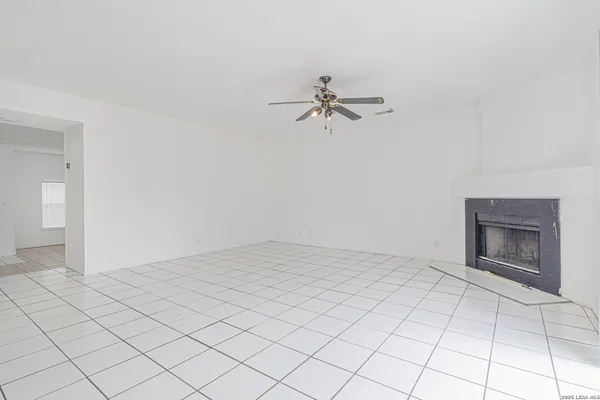 a view of empty room with fan