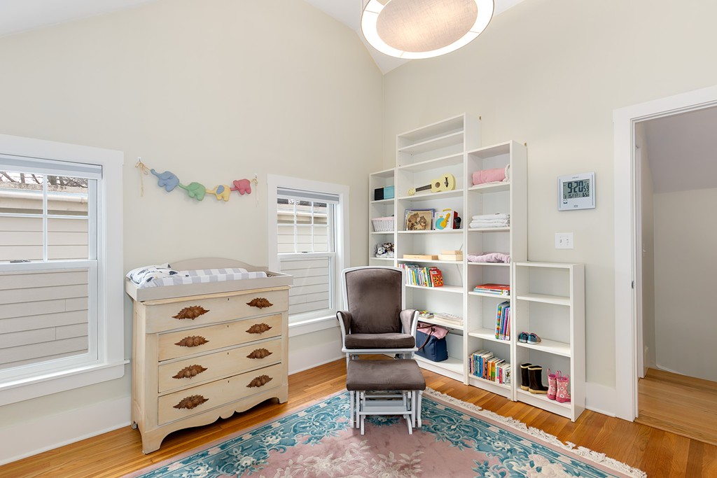 55 6th Street, Unit 55 Cambridge, MA 02141 - Photo 14 of 21 a bedroom with furniture and a book shelf