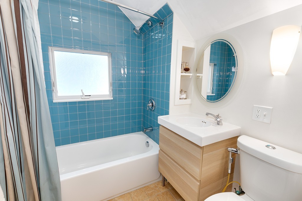 55 6th Street, Unit 55 Cambridge, MA 02141 - Photo 18 of 21 a bathroom with a sink a toilet and a bathtub