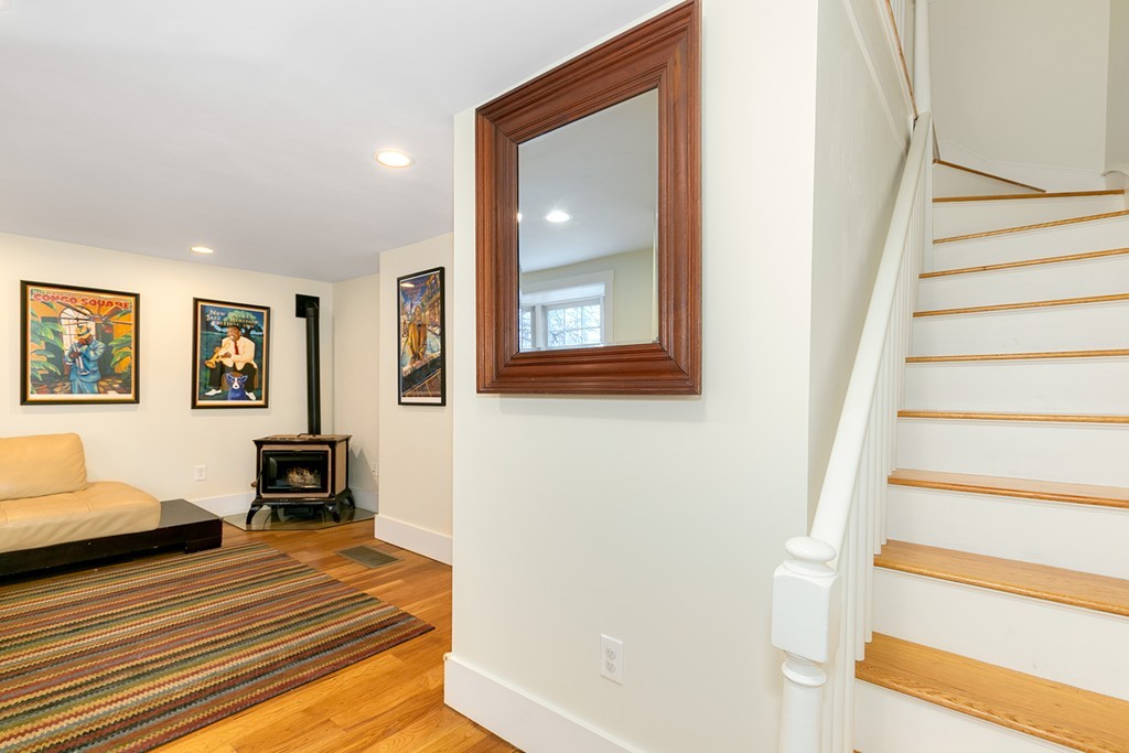 55 6th Street, Unit 55 Cambridge, MA 02141 - Photo 6 of 21 a bedroom with furniture and wooden floor