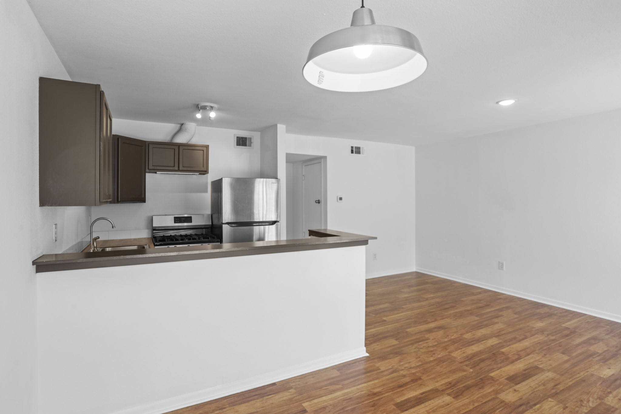 1408 Hughes Street, Unit 4 Houston, TX 77023 - Photo 8 of 27 View from the dining space into the kitchen and living area.