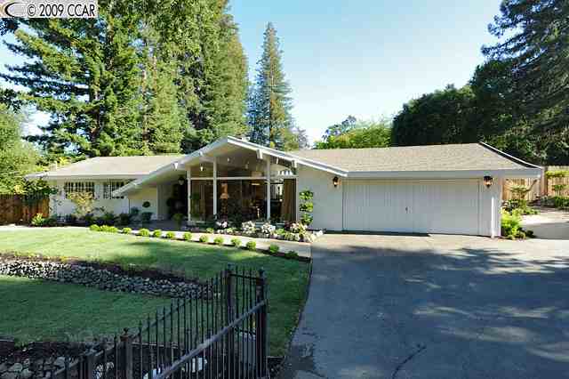 1195 Upper Happy Valley Road Lafayette, CA 94549 - Photo 1 of 1 a front view of a house with a yard and garage