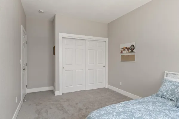 a bedroom with a bed and a cabinets