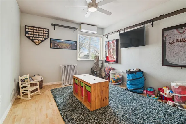 a room with furniture and flat screen tv