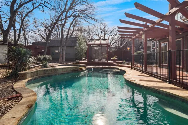 a view of swimming pool with a patio