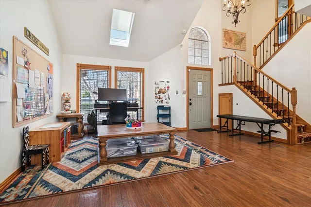 a room with lots of furniture and wooden floor