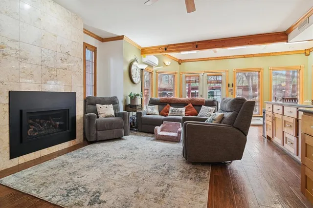 a living room with furniture and a fireplace