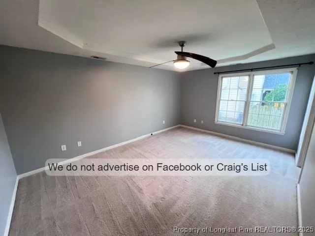 a bathroom with a table window and a shower