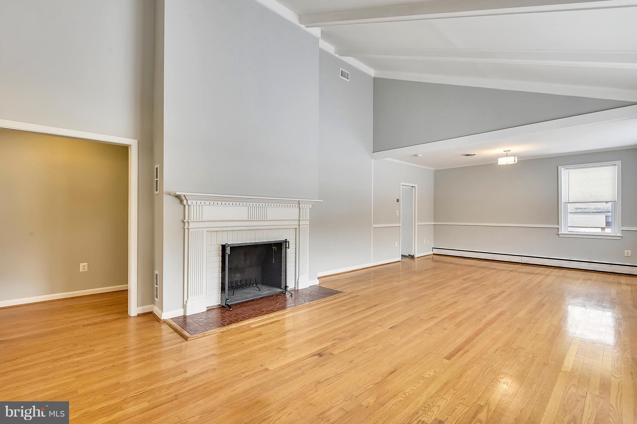 911 Gabel Street Silver Spring, MD 20901 - Photo 3 of 26 Living Room fireplace. Very Spacious!