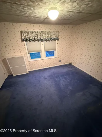 a bathroom with a sink a toilet a mirror and shower