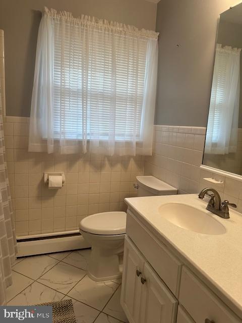 355 George Street Hanover, PA 17331 - Photo 18 of 44 a bathroom with a sink a toilet and a mirror