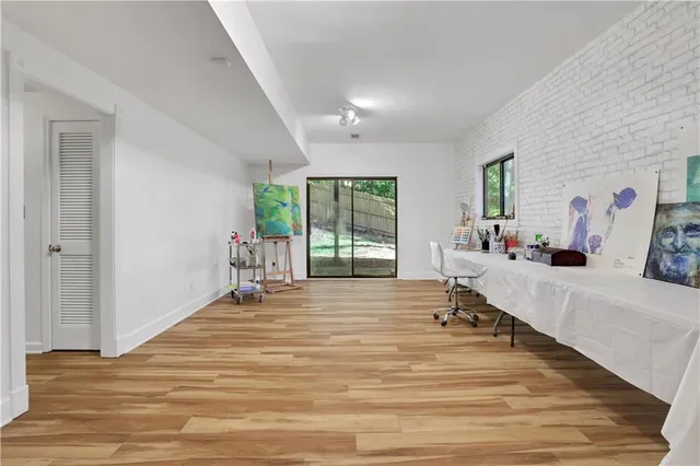 a room with wooden floor and furniture