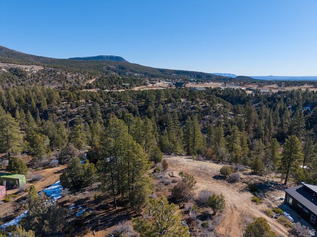 17 West Pine Street, Unit 17 Orderville, UT 84758 - Photo 1 of 15 Aerial view of a mountain backdrop