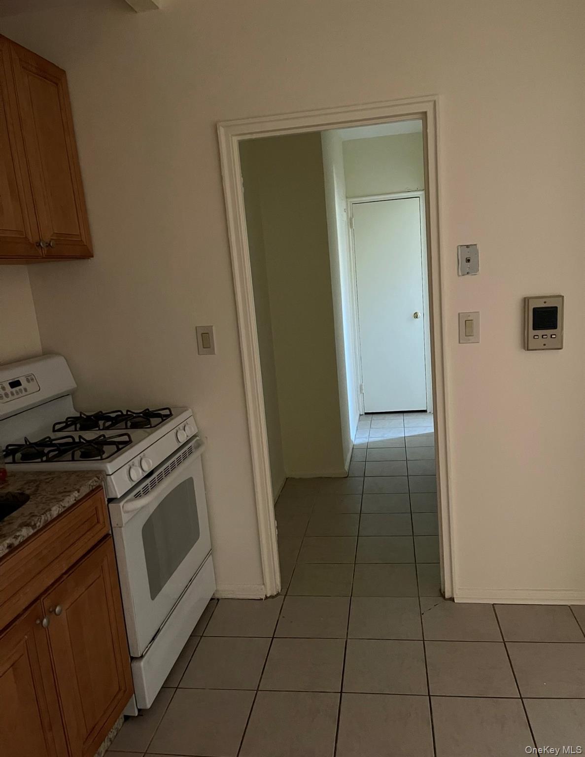 776 Bronx River Road, Unit B24 Bronxville, NY 10708 - Photo 4 of 10 a kitchen with a stove top oven and cabinets