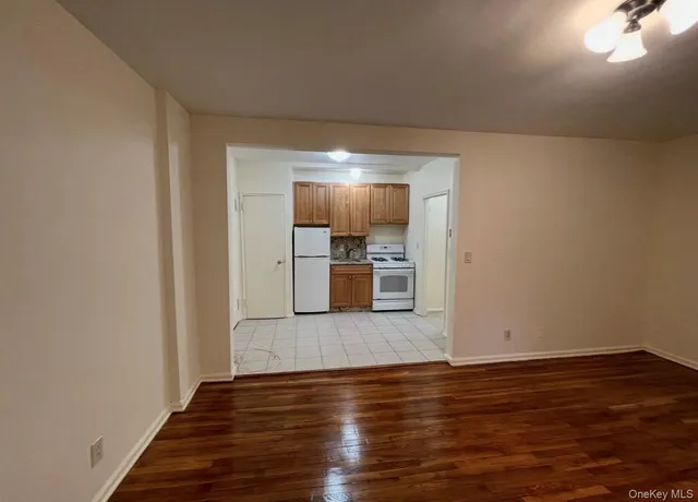 a view of a kitchen with wooden floor