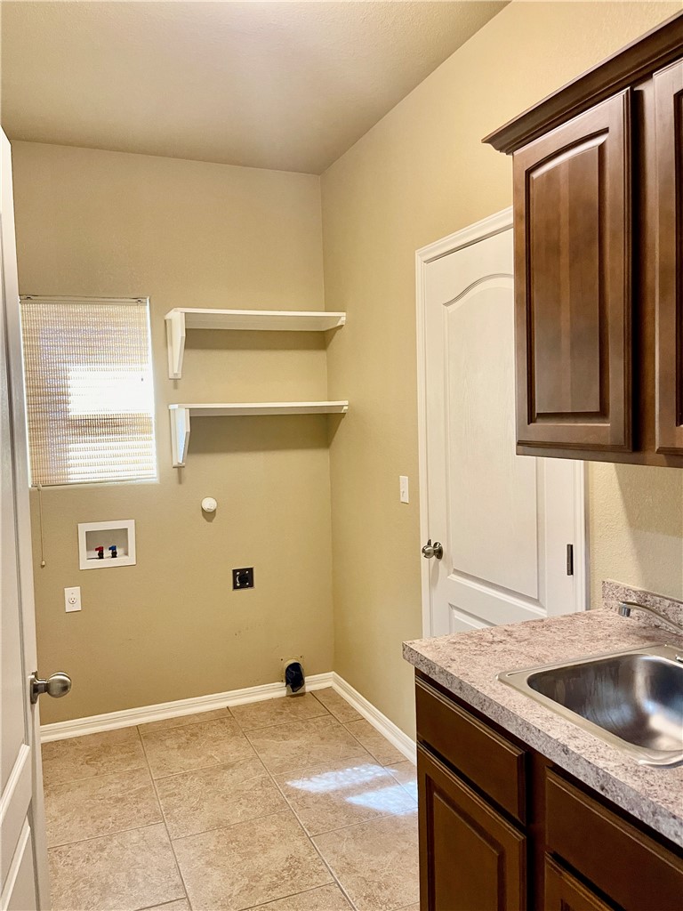 320 San Jose Street Portland, TX 78374 - Photo 14 of 23 a bathroom with a granite countertop sink and mirror