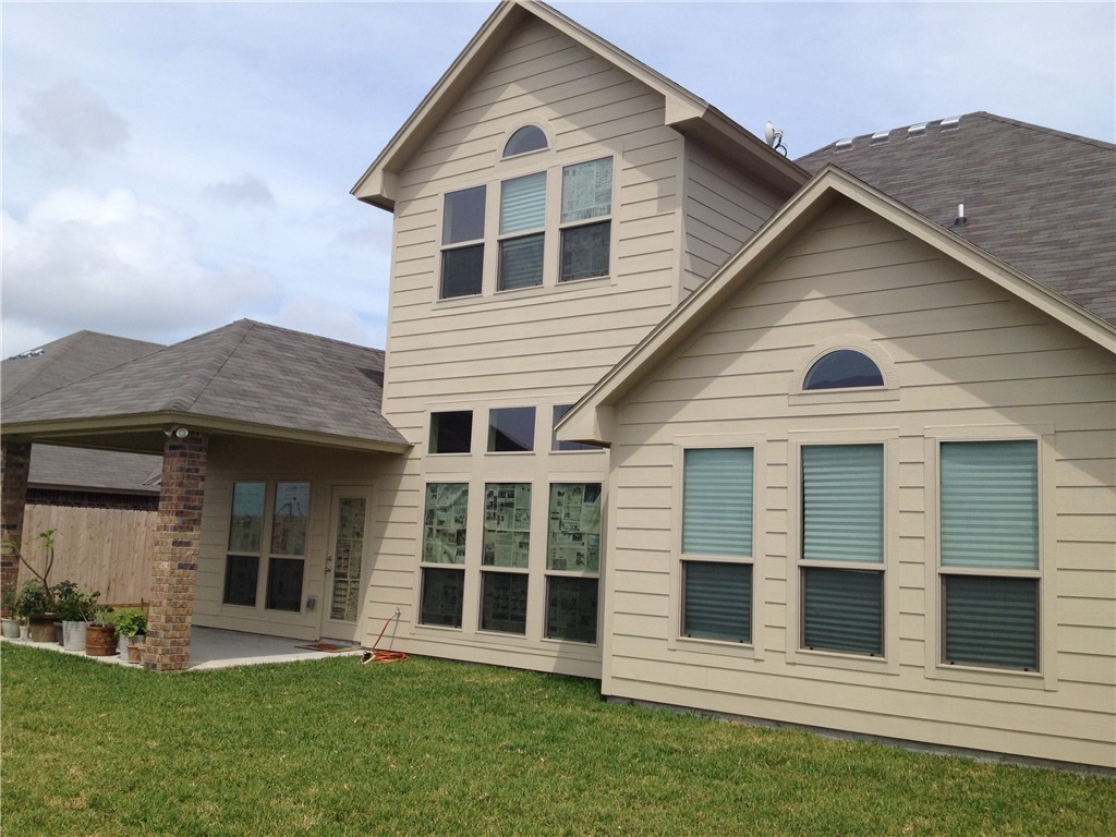 320 San Jose Street Portland, TX 78374 - Photo 2 of 23 a front view of a house with a yard