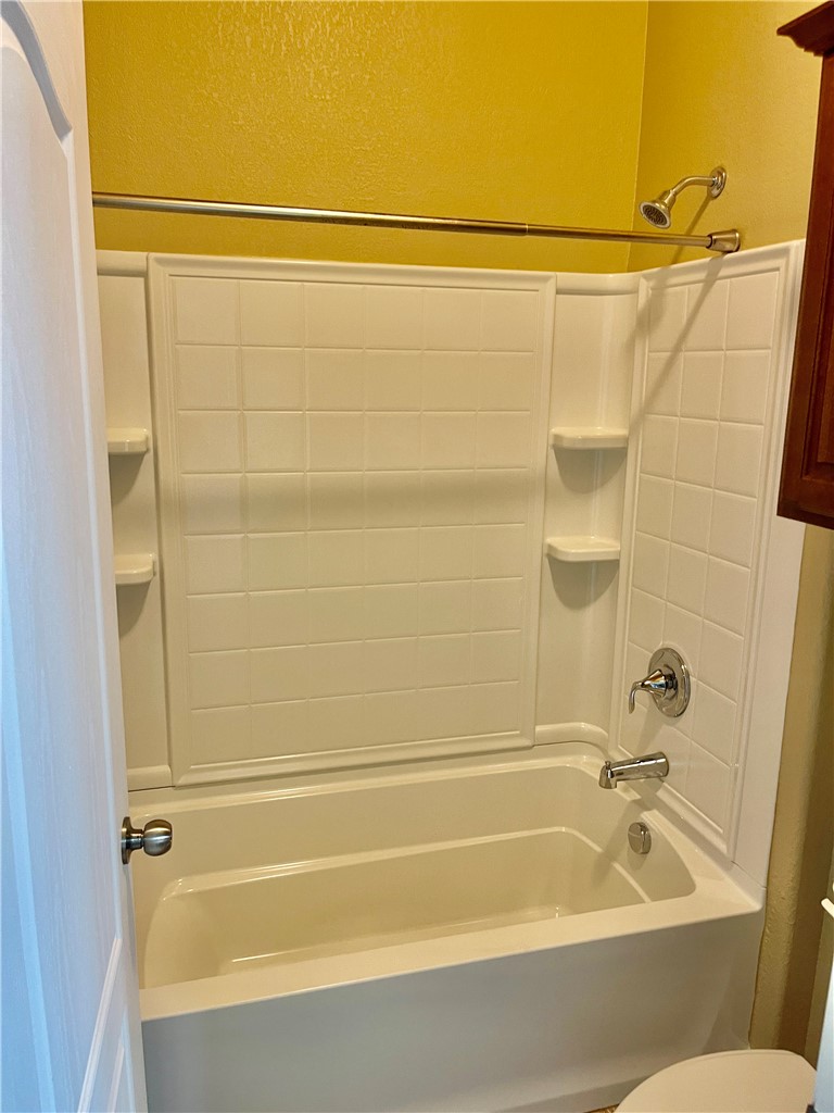 320 San Jose Street Portland, TX 78374 - Photo 21 of 23 a bathroom with a shower and a bath tub