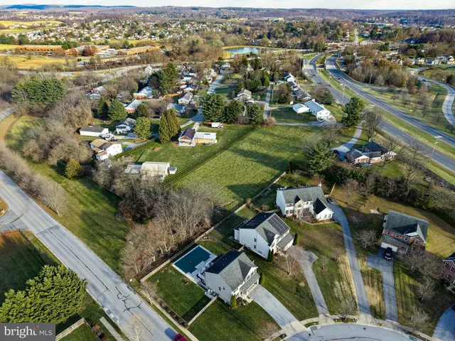 an aerial view of a house with outdoor space