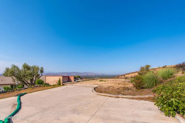 a view of swimming pool with a yard