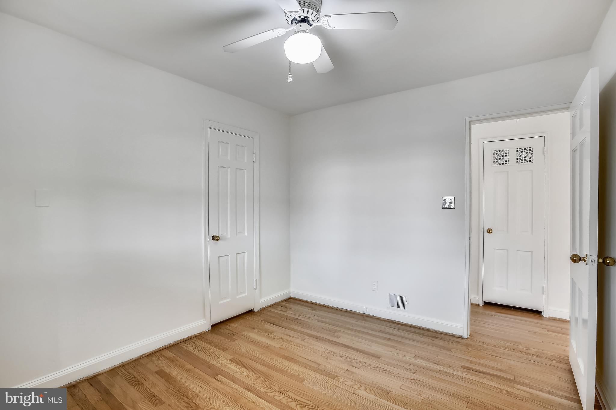 1002 Stirling Road Silver Spring, MD 20901 - Photo 22 of 39 Stunning hardwood floors continue in bedroom 3.
