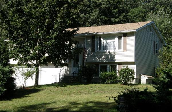 4 Hall Road Webster, MA 01570 - Photo 1 of 1 a front view of a house with a yard