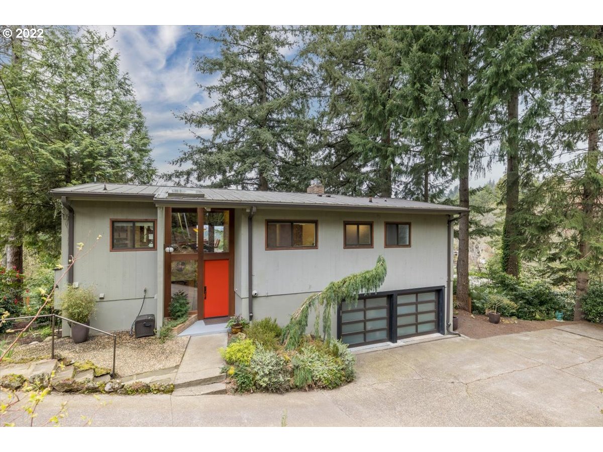 3837 Southwest Dosch Road Portland, OR 97239 - Photo 1 of 32 a view of a house with a yard and sitting area