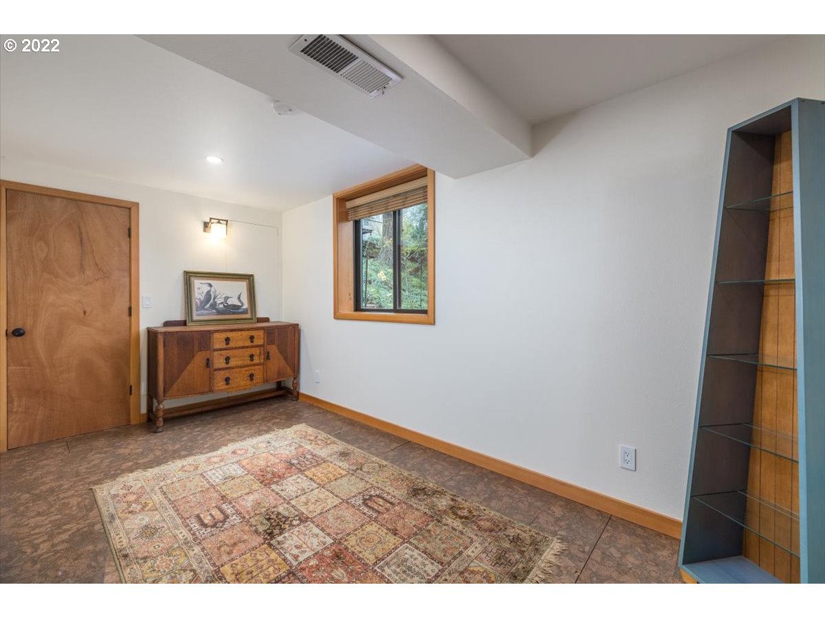 3837 Southwest Dosch Road Portland, OR 97239 - Photo 22 of 32 a living room with furniture and a window