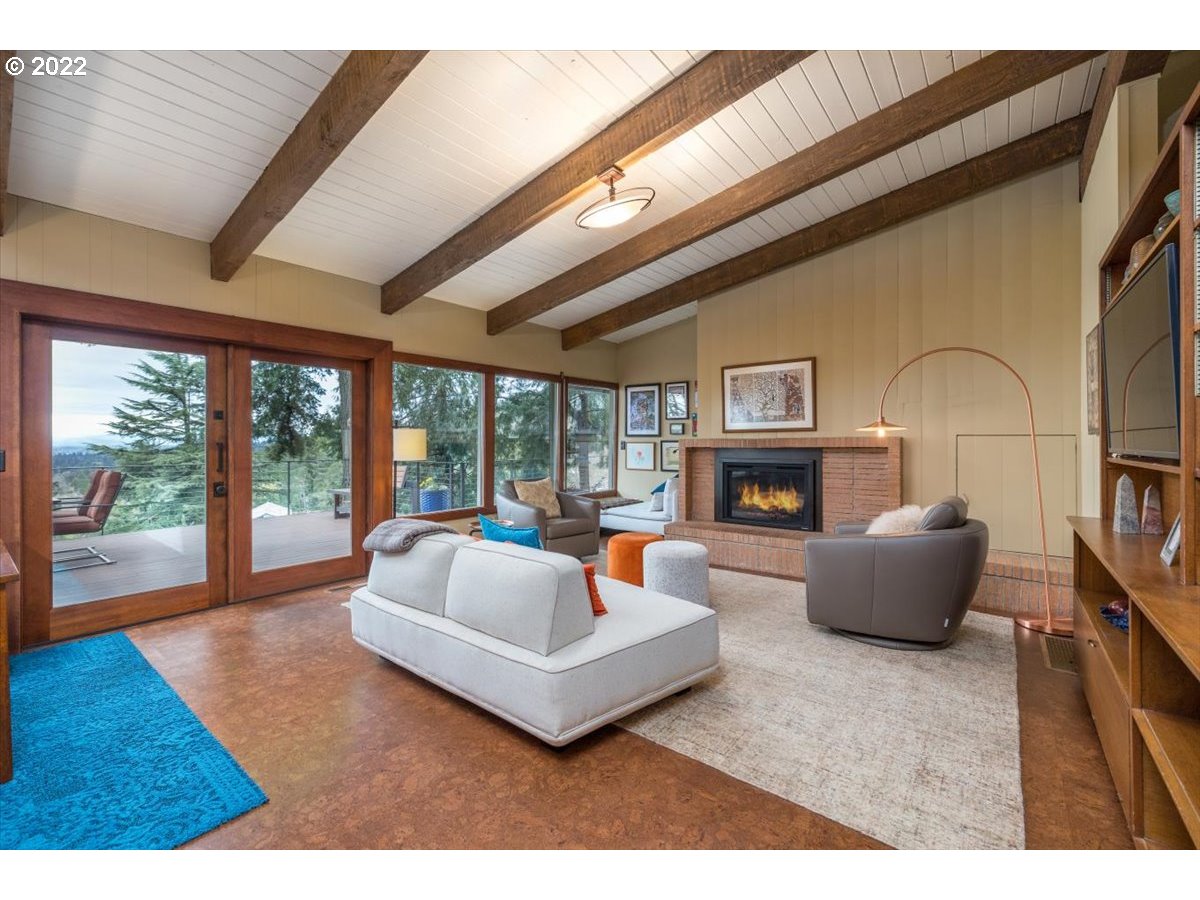 3837 Southwest Dosch Road Portland, OR 97239 - Photo 4 of 32 a living room with fireplace furniture and a large window