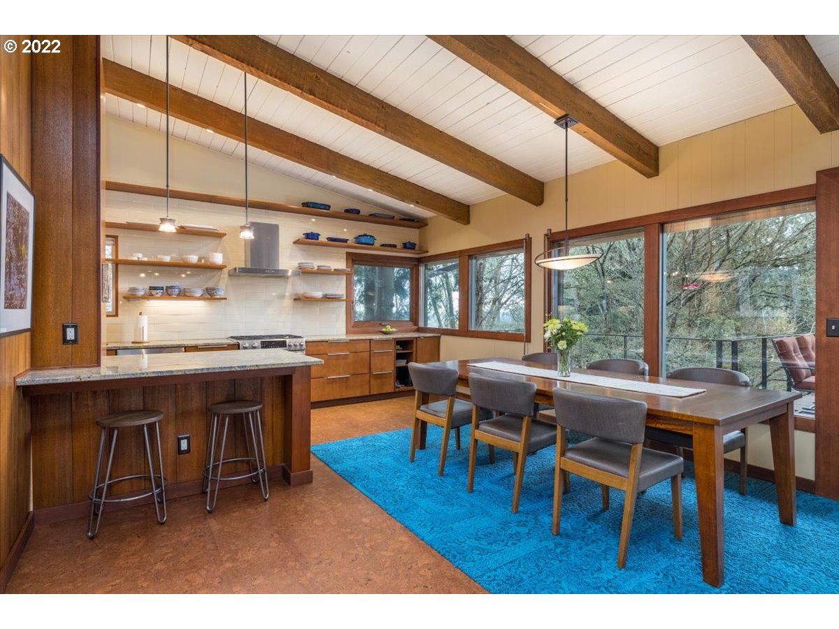 3837 Southwest Dosch Road Portland, OR 97239 - Photo 8 of 32 a dining room with furniture a rug and a large window
